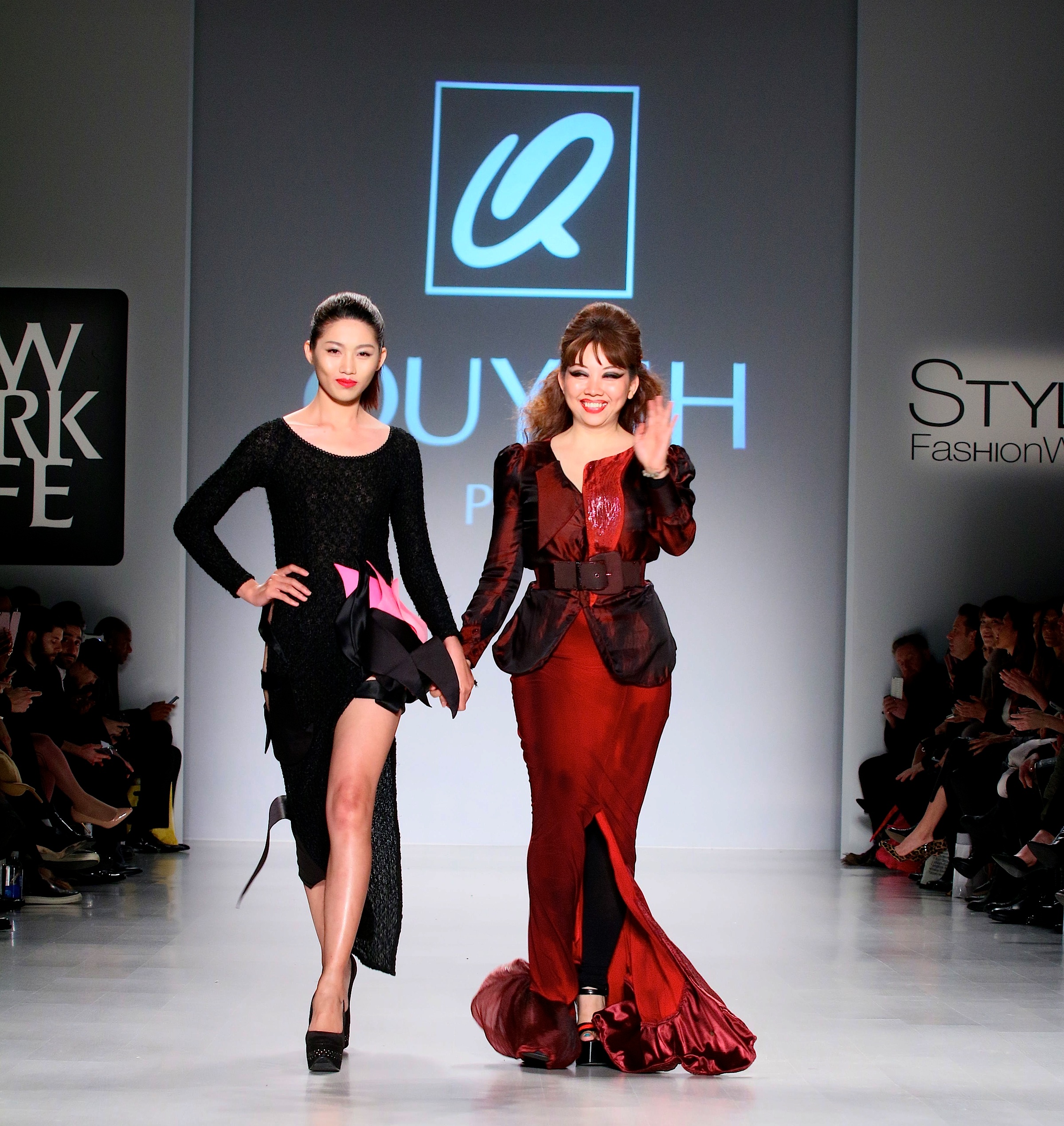 Quynh sashays down the runway with one of her elegantly dressed models in her beautiful designs. Photo courtesy of Winston Burris/Burris Agency