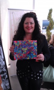Kim Phillips with her whimsical abstract artwork,"Bubblegum Explosion." 