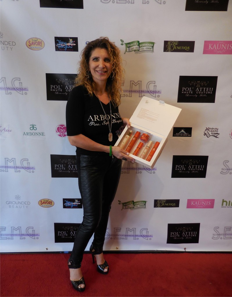 Silva Benlian, regional vice president of Arbonne, proudly poses with her products