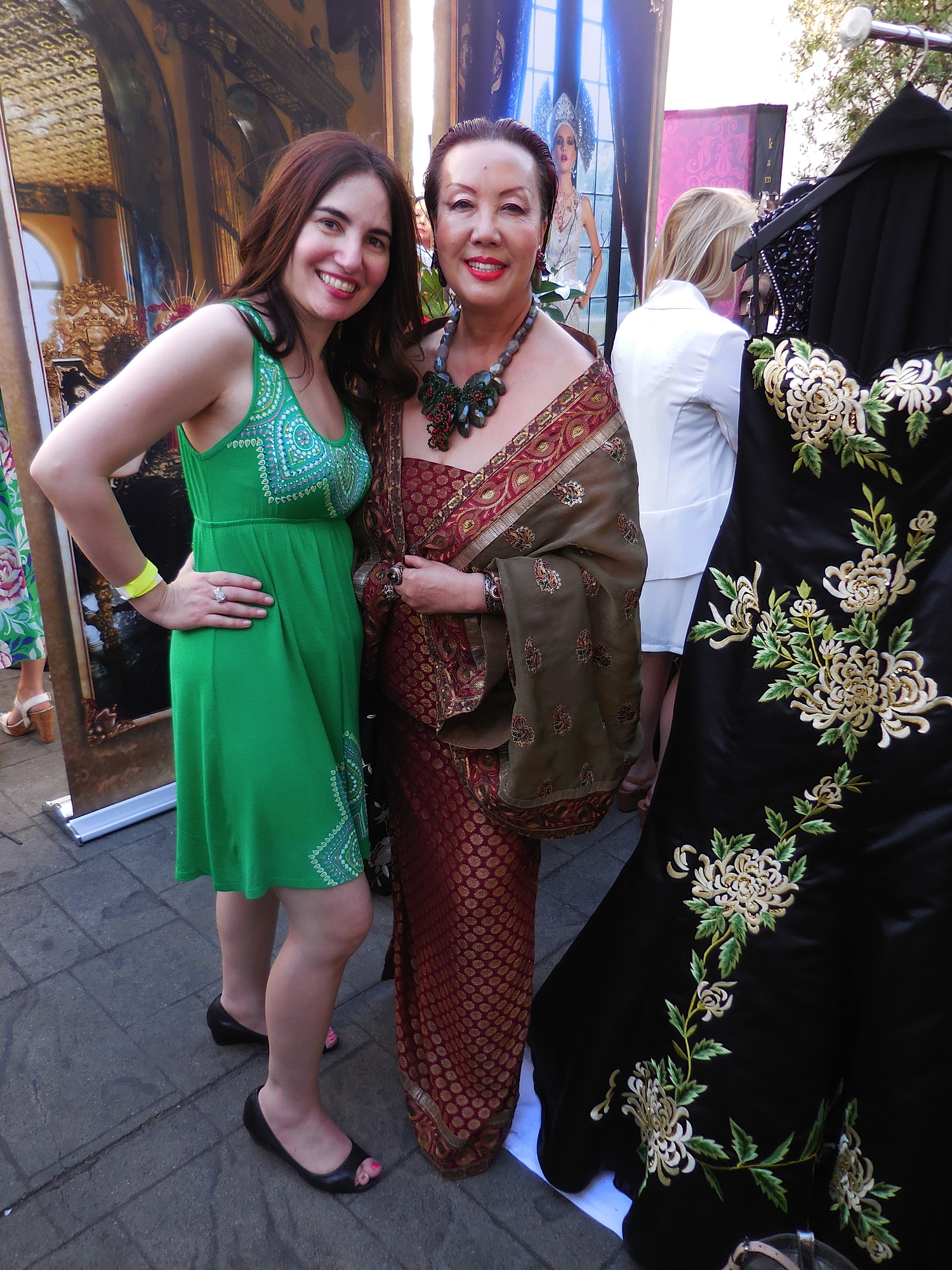 With the lovely Sue Wong, one of my favorite designers on the planet with one of her dresses. Ever the perfectionist, Sue kept telling me, "Vida, please stand beside the dress, as it has green it in like your dress. It'll look nice. I'm very visual you know." 
