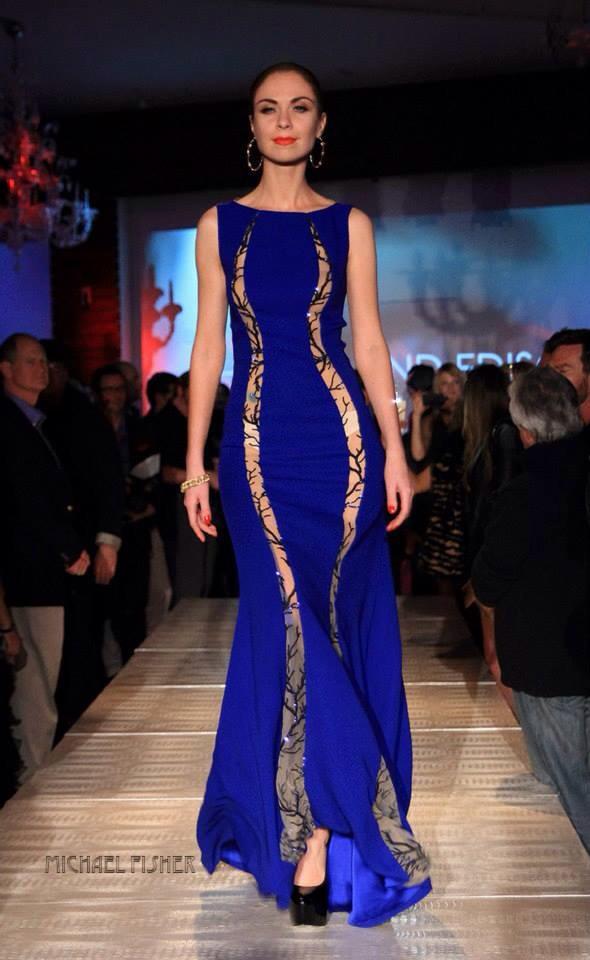 Midnight Blues..model struts the runway in a beautiful blue Thomas and Edison gown. Photo courtesy of Michael Fisher