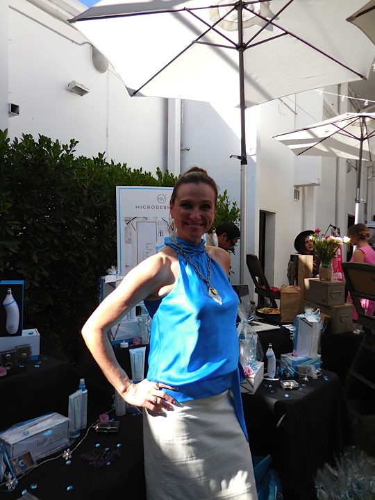 Cindy from Microderm 360 is all smiles for the gifting suite attendees