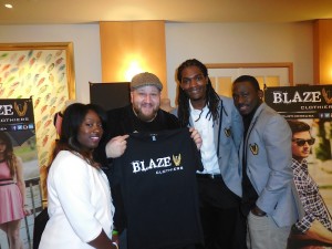 Actor Stephen Kramer Glickman with the founders of Blaze Clothing 