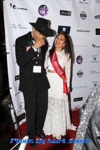 Reporter and award recipient Cerdan Smith shares a laugh on the red carpet with beauty queen Mrs. Indonesia Amelia Johnson. Photo courtesy of Mark Sevier