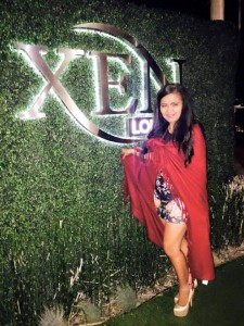 Beautiful Mrs. Phillipines Amelia Johnson strikes a pose under Xen Lounge's beautiful sign and entrance.  