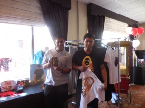 Eric and David Munoz of M the Movement hold up some cool T-shirts from the line