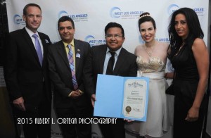 Vida receives her commendation from the West Los Angeles Chamber of Commerce. From left to right: Vice President Steve Little, President Roozbeh Farahanipour, Phil Bennett of the City of Los Angeles, Vida, and Elham Yaghoubian, human rights activist, author and handbag designer, and Board Member of the Chamber at the Ceremony. Photo courtesy of Albert L. Ortega/GettyImages.
