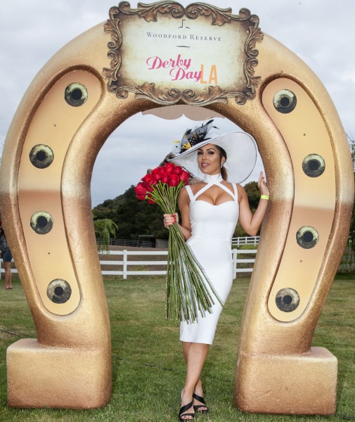 Model Carissa Rosario looking elegant with her roses at the Derby Day LA event. Photo by Andrew Arnold