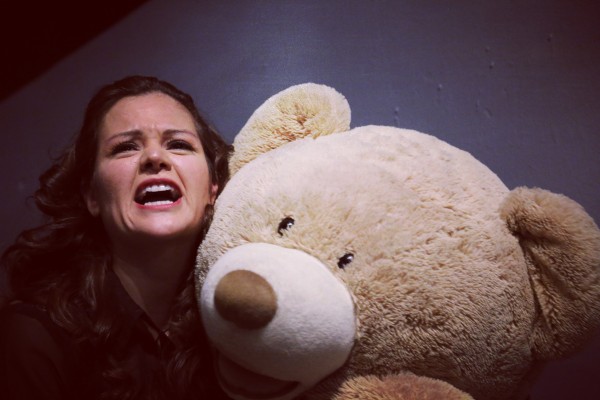 Vanessa sharing a moment with her teddy bear in American Man Dream. Photo by D Brown