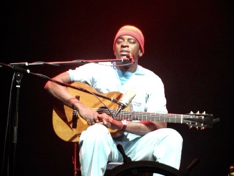 Seu Jorge in his fashionable red knit hat.