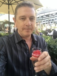 Writer and photographer for the Experience Magazine, Dustin Brown, enjoying a glass of the Kir Royal at Ladurée 